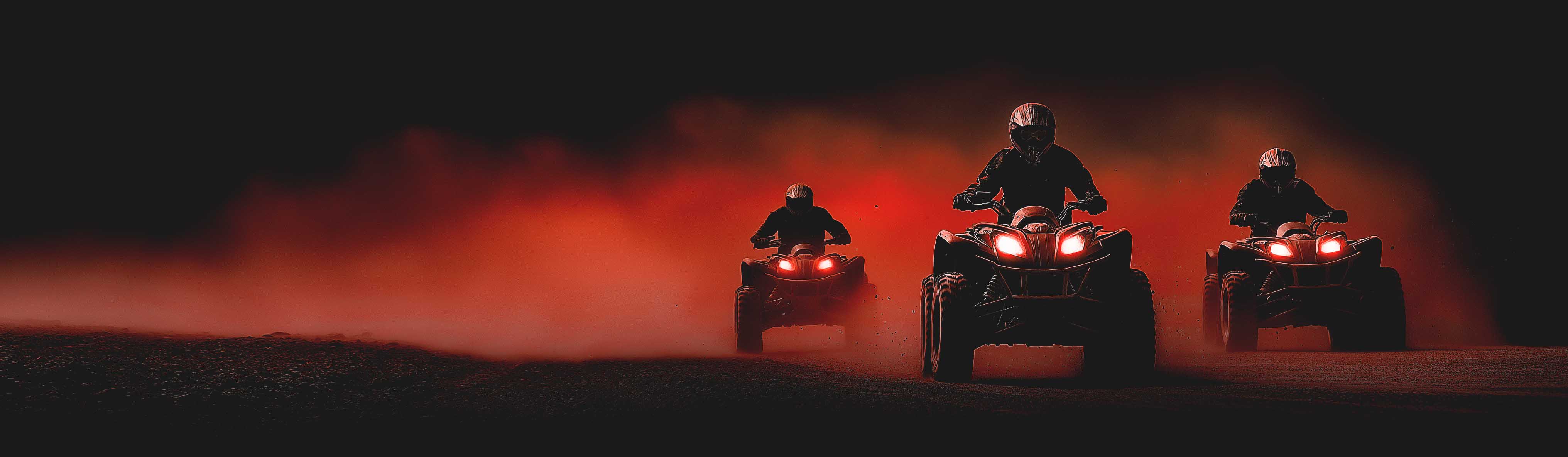 Panoramic photo of a group of quad tav riders on a mud track